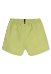 Lime green swim shorts with an elastic waistband, featuring a striped accent at the back and a smooth, lightweight texture.