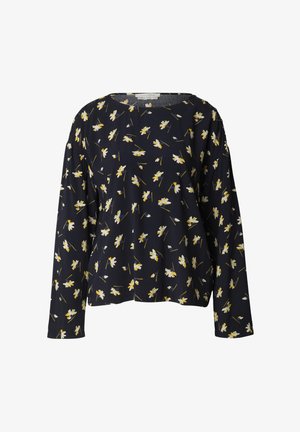 Marineblauwe blouse met lange mouwen met verspreide witte en gele madeliefjesprint en een ronde halslijn.