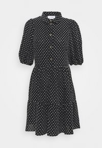 Robe noire boutonnée avec motif géométrique blanc, manches courtes bouffantes, jupe à volants et col classique. Boutons dorés.