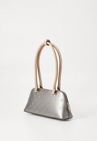 Metallic gray handbag with embossed patterns, two tan handles, and a zip fastening. Features a structured, curved silhouette.