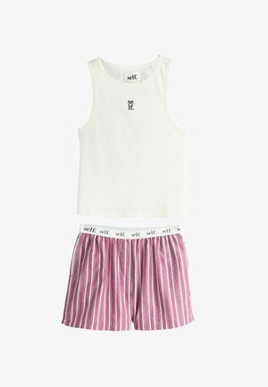 White sleeveless ribbed tank top with "self." text paired with pink, white, and navy vertical striped shorts with "self." printed waistband.