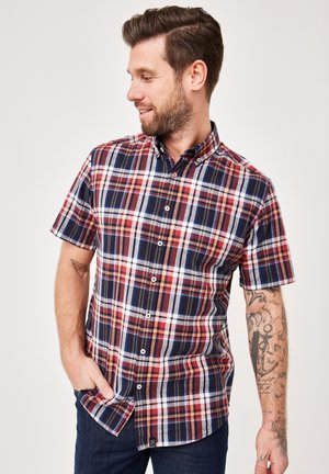 Kurzärmliges Karoshemd in Marineblau, Rot, Weiß und Grün. Button-down-Kragen, Knöpfe vorne und ein Etikett an der Seite. Aus Baumwolle.