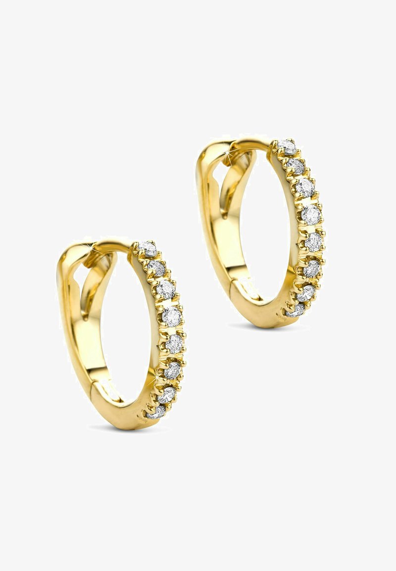 Zlate uhane v obliki obroča, ki vsebujejo vrstico majhnih, okroglih, prozornih draguljev, postavljenih v zatič ob robu. Gladka polirana površina.