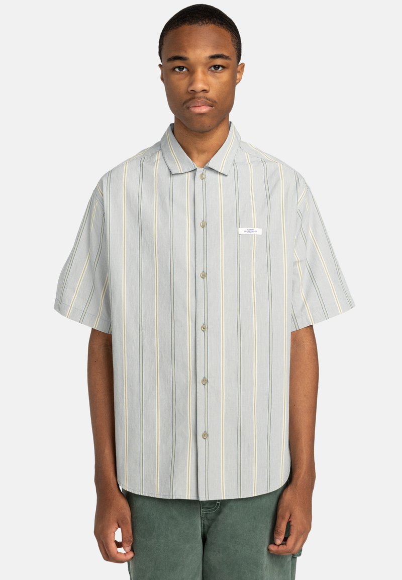 Short-sleeve button-up shirt in light gray with blue and yellow vertical stripes, featuring a small logo patch and a classic collar design.