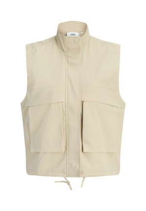 Beeživärviline varrukateta vest kõrge kraega, eesmine tõmblukk kaane all peidetud, kaks suurt esimest taskut ja reguleeritav paeläär.