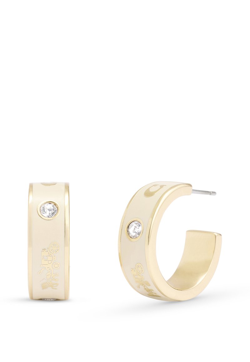 Boucles d'oreilles en or en forme de créoles avec une finition polie, ornées d'une pierre transparente et de motifs gravés sur la surface extérieure.