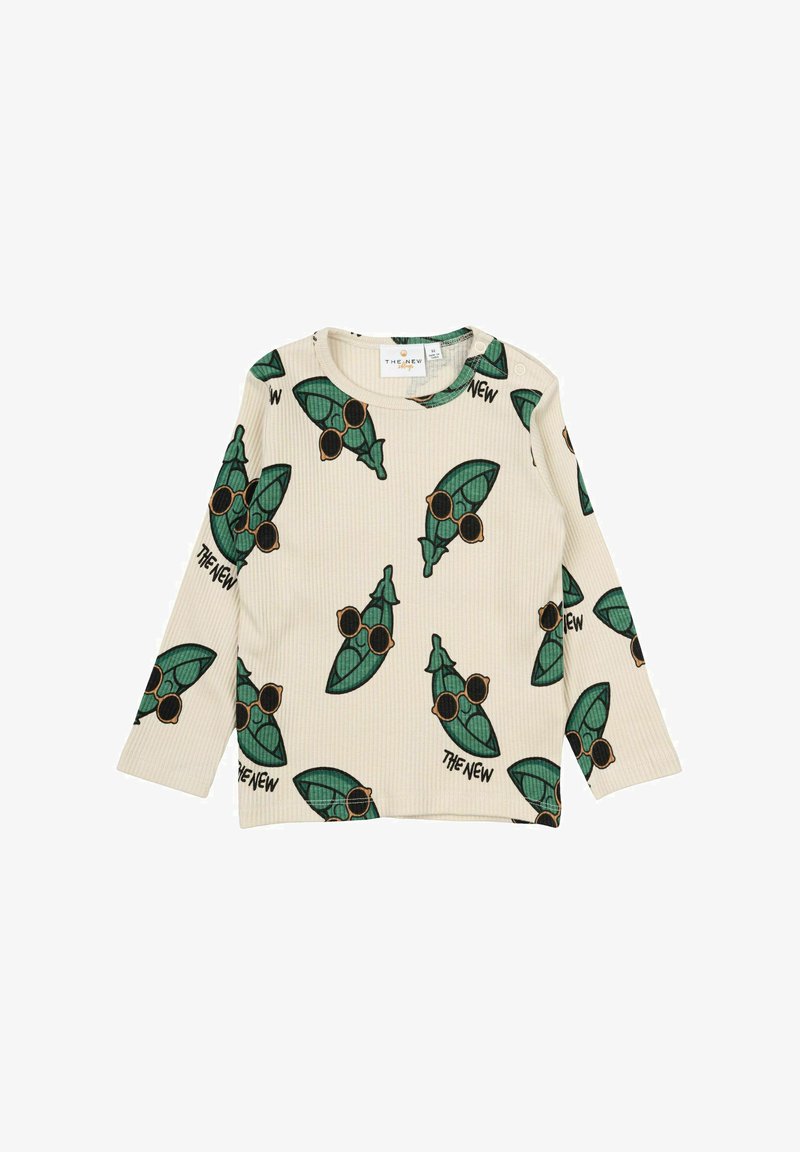 Langärmliges, geripptes Oberteil in Creme mit einem wiederholten grünen Blattmuster, schwarzen Sonnenbrillen und schwarzen Textelementen.