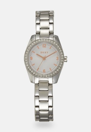 Silver stainless steel watch with a round white dial, rose gold accents, crystal-encrusted bezel, and a metal link bracelet.