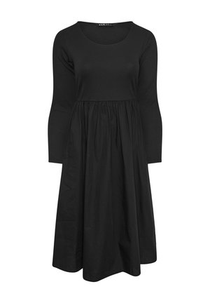 Czarna midi sukienka z długim rękawem, z dopasowanym żebrowanym topem i marszczoną, zwiewną częścią spódnicy.