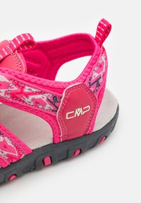 Pink sports sandal with patterned fabric upper, cushioned insole, black rubber outsole, and CMP logo on the heel.