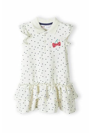 Weißes ärmelloses Kleid mit schwarzem Sternenmuster, gerüschtem Saum, Kragen, Knöpfen und bestickten roten Kirschen auf der Brust.