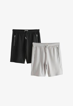 Zwei Paar legere Shorts, eine schwarz und eine hellgrau, mit Kordelzug an der Taille und Reißverschlusstaschen an den Seiten.