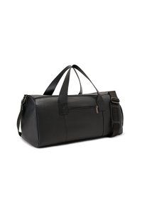 Black duffle bag with textured surface, dual top handles, and adjustable shoulder strap. Features a zippered pocket on the side.