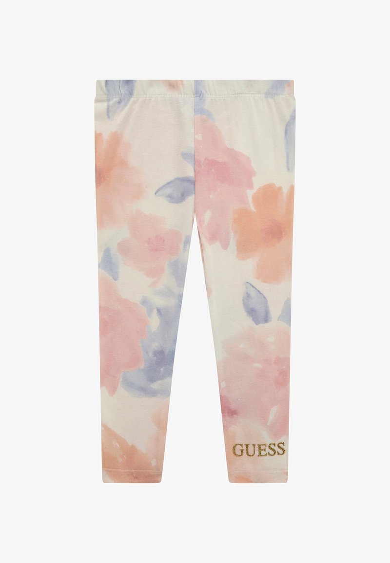 Leggings en coton léger avec un motif floral aquarelle dans des tons de rose doux, pêche et bleu, arborant un logo doré "GUESS" sur la jambe inférieure.