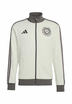 Jasnoszara kurtka na zamek z ciemnoszarym kołnierzem i mankietami. Posiada trzy paski na rękawach, logo na piersi oraz gładką teksturę materiału.