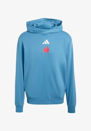 Sweat à capuche bleu avec une poche kangourou avant, une capuche avec cordon de serrage, et un logo de coq rouge. Fabriqué en tissu doux avec des poignets et un ourlet côtelés.