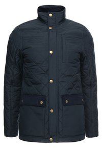 Námořnická prošívaná bunda s vysokým límcem, zlatými doplňky, dvěma předními kapsami s klopami a náprsní kapsou na zip.