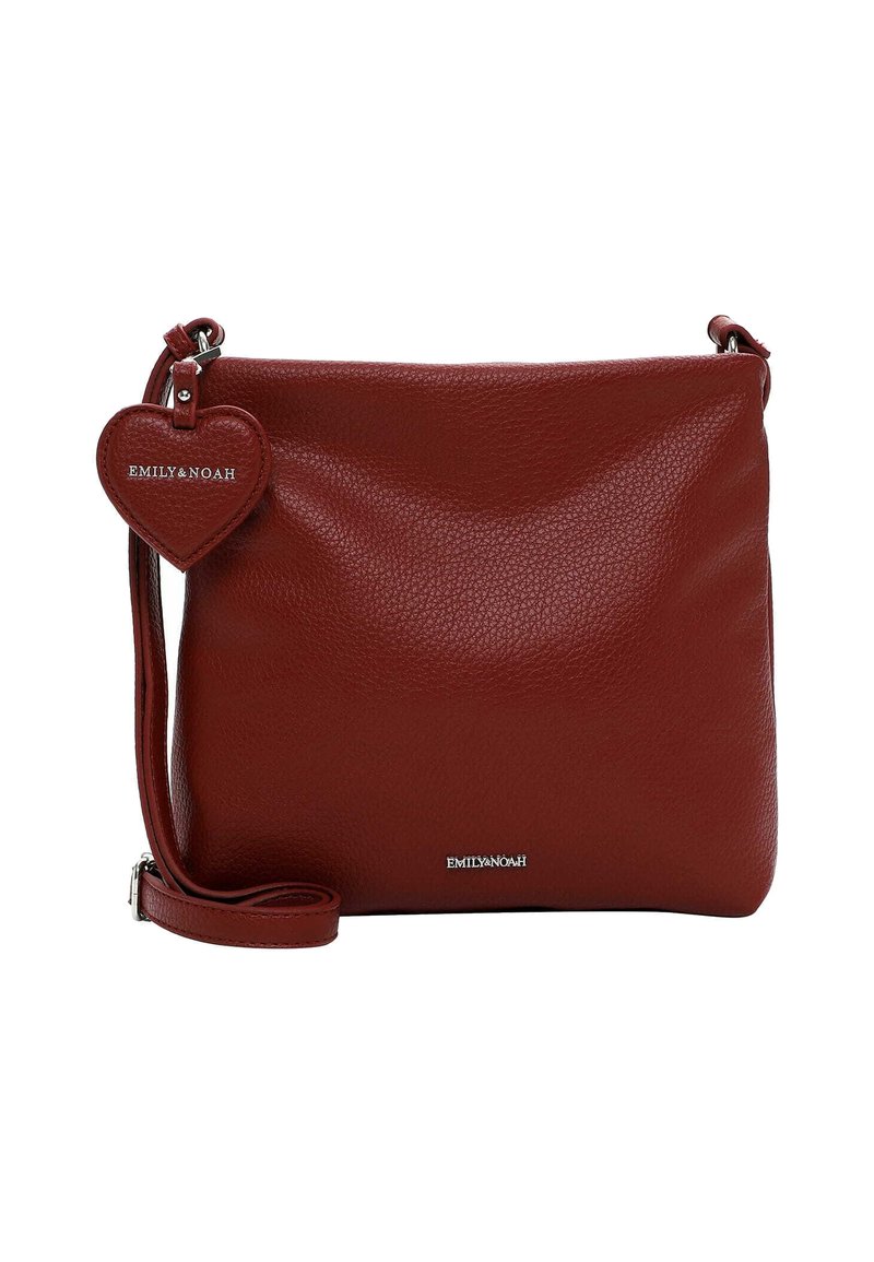 Red leather crossbody bag with a textured finish, adjustable strap, and a heart-shaped tag featuring the brand name embossed on it.