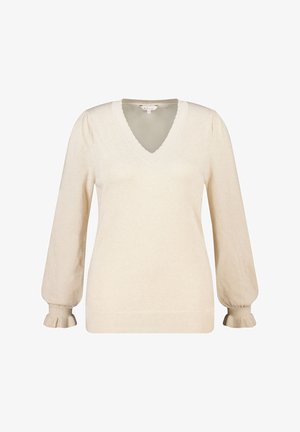 Pull-over beige clair avec col en V, manches bouffantes et poignets à volants. Texture douce avec un léger scintillement. Ourlet côtelé.