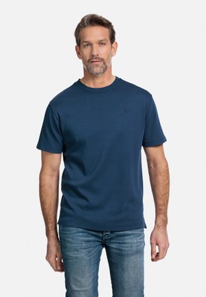 Marineblauwe T-shirt met korte mouwen van een katoenmix, met een ronde hals en een geborduurd logo. Gepaard met lichtblauwe denim jeans.