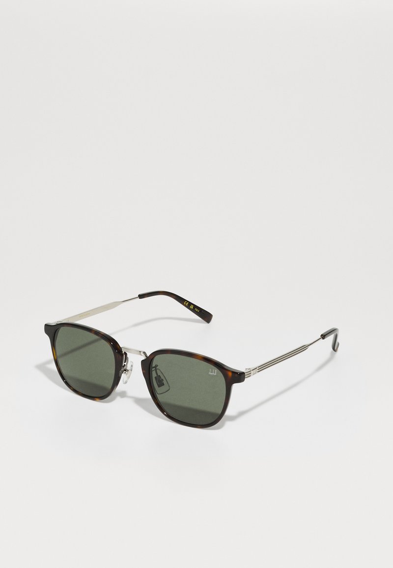 Tortoiseshell sunglasses with green lenses, silver metal accents, and a squared design. Features thin metal arms with a textured surface.