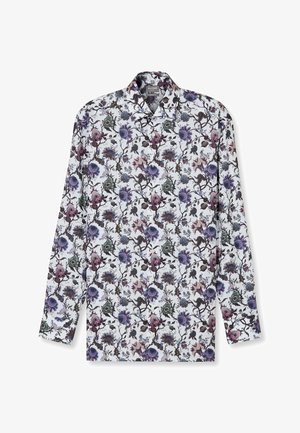 Langärmliges Hemd aus Baumwolle mit weißem Grund, das ein farbenfrohes Blumenmuster in lila, grün und schwarzen Farbtönen zeigt.