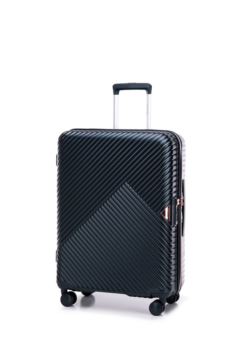Black hard-shell suitcase with diagonal ribbed texture, silver handle, and four wheels. Features a triangular logo accent and zipper closure.