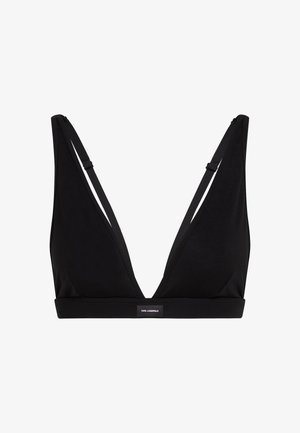 Must mustriba, millel on madal kaelus ja see on valmistatud siledast kangast. Sellel on õhukesed reguleeritavad rihmad ja logodetail piirdel.