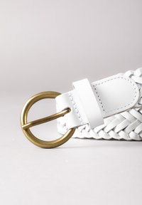 White braided leather belt with a large brass buckle. Features a smooth texture with neat stitching and a loop for adjustment.