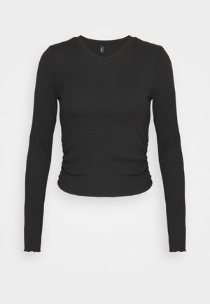 Μαύρο μπλουζάκι μακρυμάνικο φτιαγμένο από ριπ ύφασμα, με στενή γραμμή και απαλή ραφή στις πλευρές, με κυματιστές άκρες στα μανίκια.