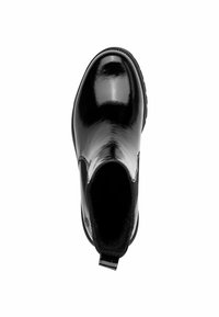 Botte chevillère noire brillante, panneaux latéraux élastiques, bout rond, dessus texturé, languette arrière pour un enfilage facile, et semelle en caoutchouc plate.
