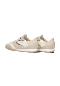 Beige sneakers featuring a mix of smooth and suede textures, rounded toe, subtle accent details, and a lightweight rubber sole.
