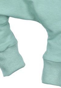 Muntgroene sweatshirtmanchet gemaakt van zachte, rekbare stof. Kenmerkt zich door een geribbelde textuur en een losse pasvorm. Eenvoudig, onopgesmukt ontwerp.