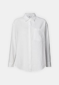 White linen shirt with long sleeves, button-down front, a single chest pocket, and a relaxed fit. Smooth texture with a classic collar.