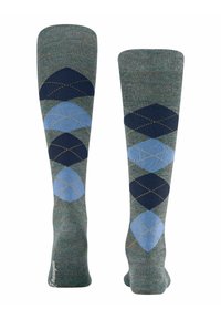 Skarpetki do kolan w zielonych i niebieskich odcieniach z wzorem argyle z granatowymi diamentami i kontrastującym żółtym ściegiem. Miękka tekstura.