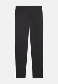 Leggings negras hechos de tela suave y elástica. Cuentan con una cintura ancha y piernas ajustadas, con puños texturizados en el tobillo.