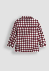 Camicia a maniche lunghe a quadretti rossi e bianchi, con polsini abbottonati, colletto e orlo dritto. Tessuto testurizzato con una finitura morbida.