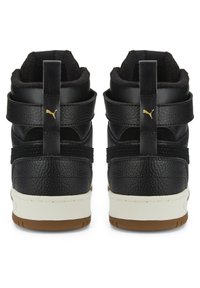 Black high-top sneakers with a textured leather upper, dual straps, and a white midsole. Gold logo accent on the heel; gum rubber outsole.