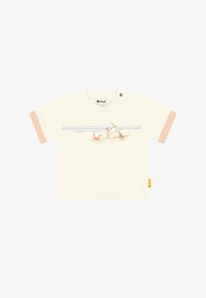 Cream-colored cotton t-shirt with short striped sleeves, featuring a graphic of a bear and crab. Includes a snap closure at the shoulder.