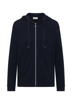 Sweat à capuche zippé bleu marine avec manches longues, poches frontales, capuche avec cordon de serrage, et étiquette de marque visible à l'intérieur du col.