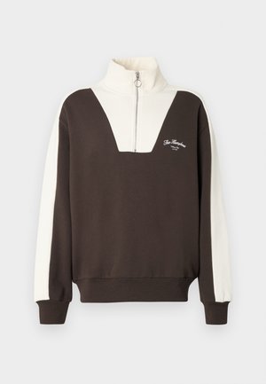 Braun- und cremefarbenes, farbblockiertes Sweatshirt mit hohem Kragen, Viertelreißverschluss und gesticktem Logo auf der Vorderseite. Weicher Stoff, gerippte Bündchen.