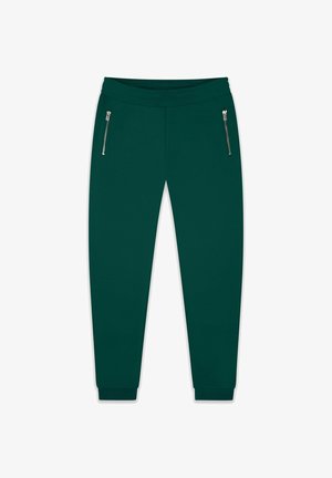 Grüne Jogginghosen aus weichem Stoff, mit einem Kordelzugbund, zwei seitlichen Reißverschluss-Taschen und gerippten Bündchen an den Knöcheln.