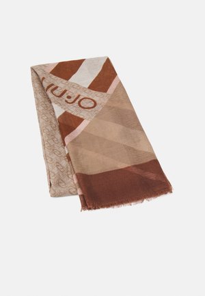 Écharpe rectangulaire pliée avec des motifs géométriques beige, marron et rose et un logo imprimé près du bord sur fond blanc.