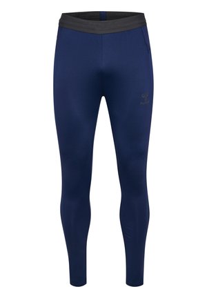 Leggings bleu marine en tissu extensible, dotés d'une taille élastique noire et d'un petit logo sur la cuisse gauche. Design slim-fit sans poches.