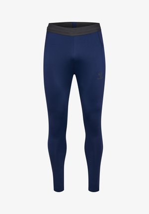 Leggings bleu marine en tissu extensible, dotés d'une taille élastique noire et d'un petit logo sur la cuisse gauche. Design slim-fit sans poches.