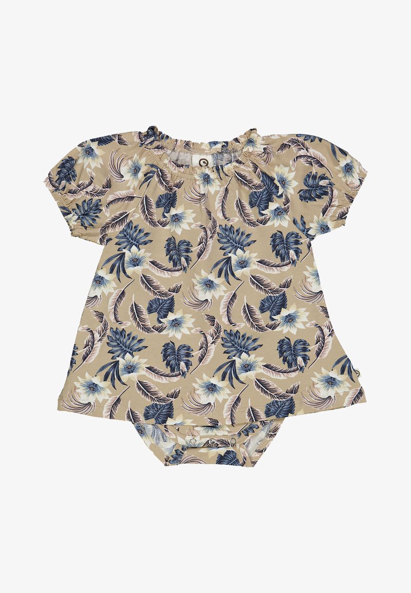 Krátký rukáv overal v béžové barvě s květinovým vzorem, který obsahuje modré a krémové květy, nařasený výstřih a zapínání na patentky na spodní části.