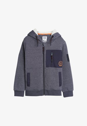 Grijze rits-hoodie met een zachte witte voering, navy accentzak, verstelbare trekkoordcapuchon en geribbelde boorden; voorzien van logo-detail op de zak.