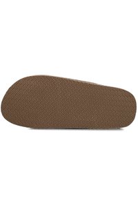 Brown rubber shoe sole with a zigzag tread pattern, rounded toe, and slightly raised edges. Textured surface for traction and stability.