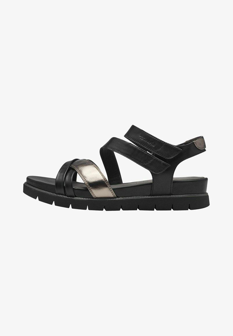Schwarze Ledersandalen mit metallischen Akzenten, ausgestattet mit überkreuzten Riemen und einer dicken schwarzen Gummisohle für zusätzlichen Komfort und Unterstützung.