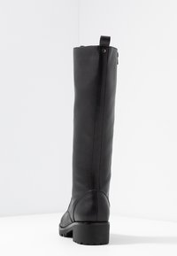 Knee-high black leather boot with a textured finish, side stitching, and a low block heel. Features a pull tab at the top for ease of wear.